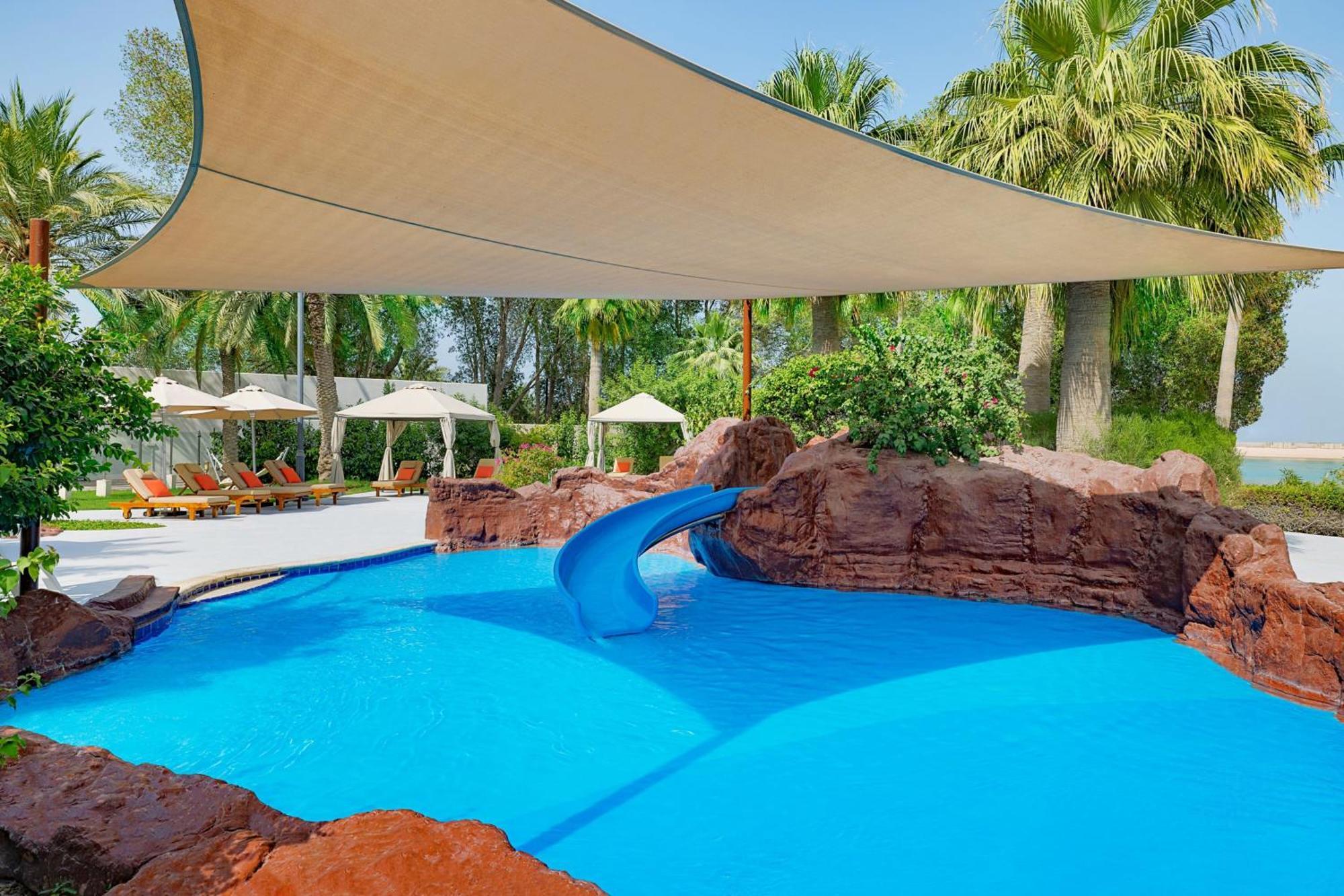The Ritz-Carlton, Doha Hotel Eksteriør billede Shade sail over a pool